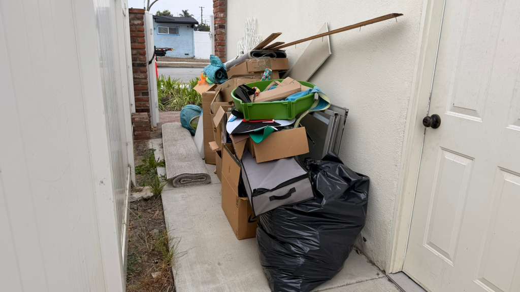Los Angeles home interior packed with vintage furniture and belongings before estate cleanout